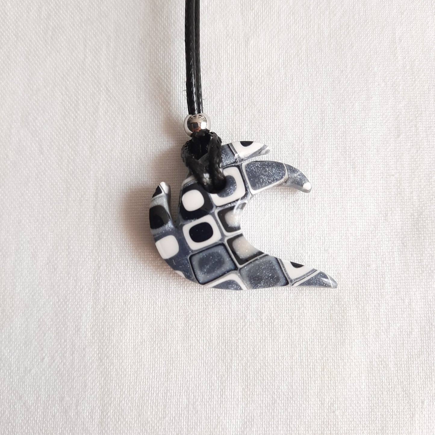 colgante ola negro blanco