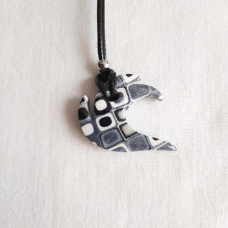 colgante ola negro blanco