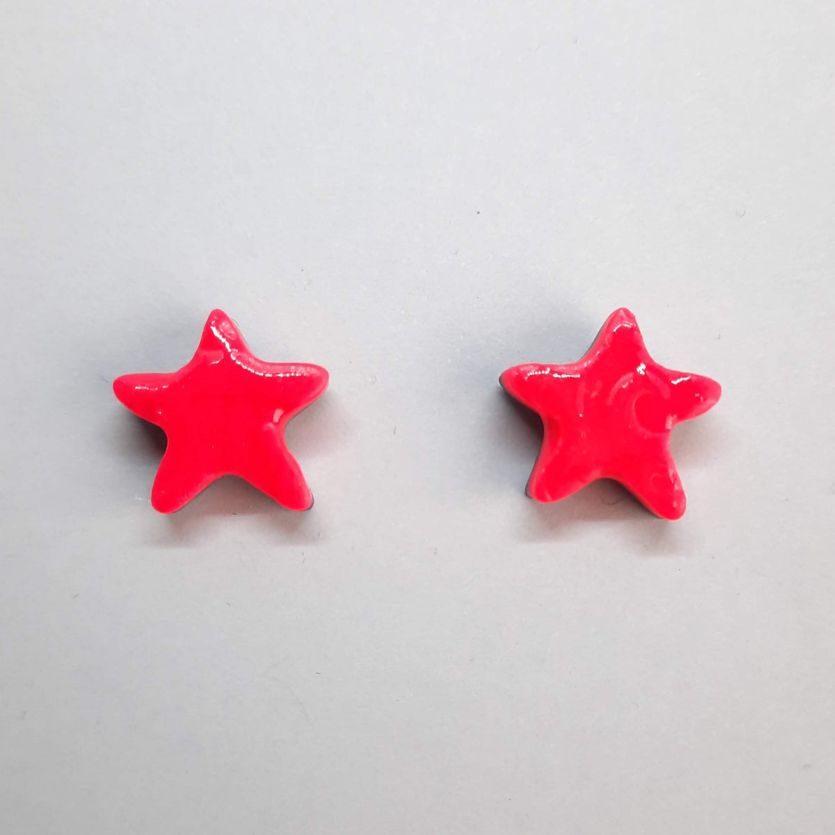 Pendientes Botón Estrella Rosa Neon